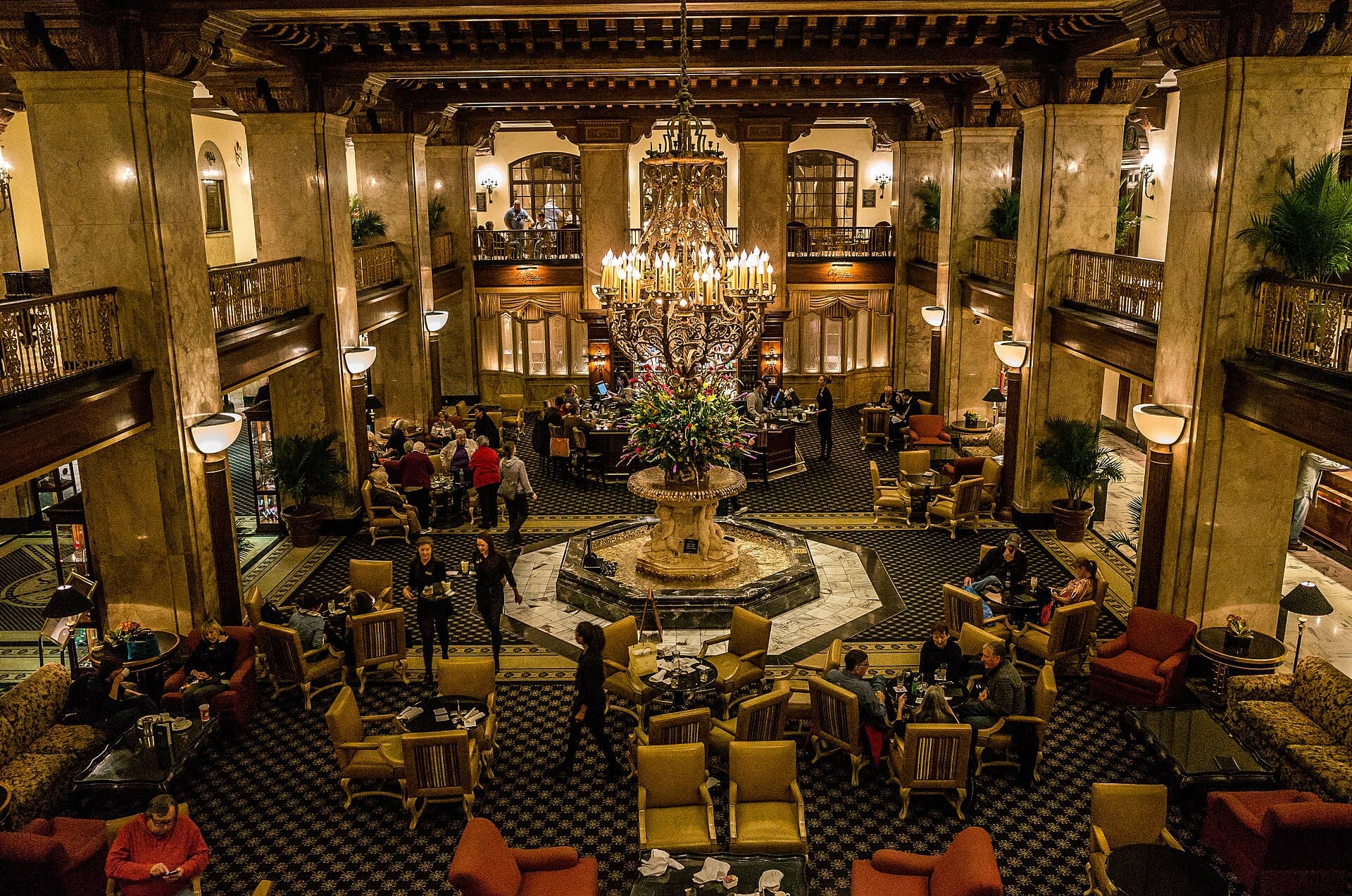 The grand lobby, travertine fountain, and chandelier of The Peabody Hotel in downtown Memphis — home of Chez Philippe