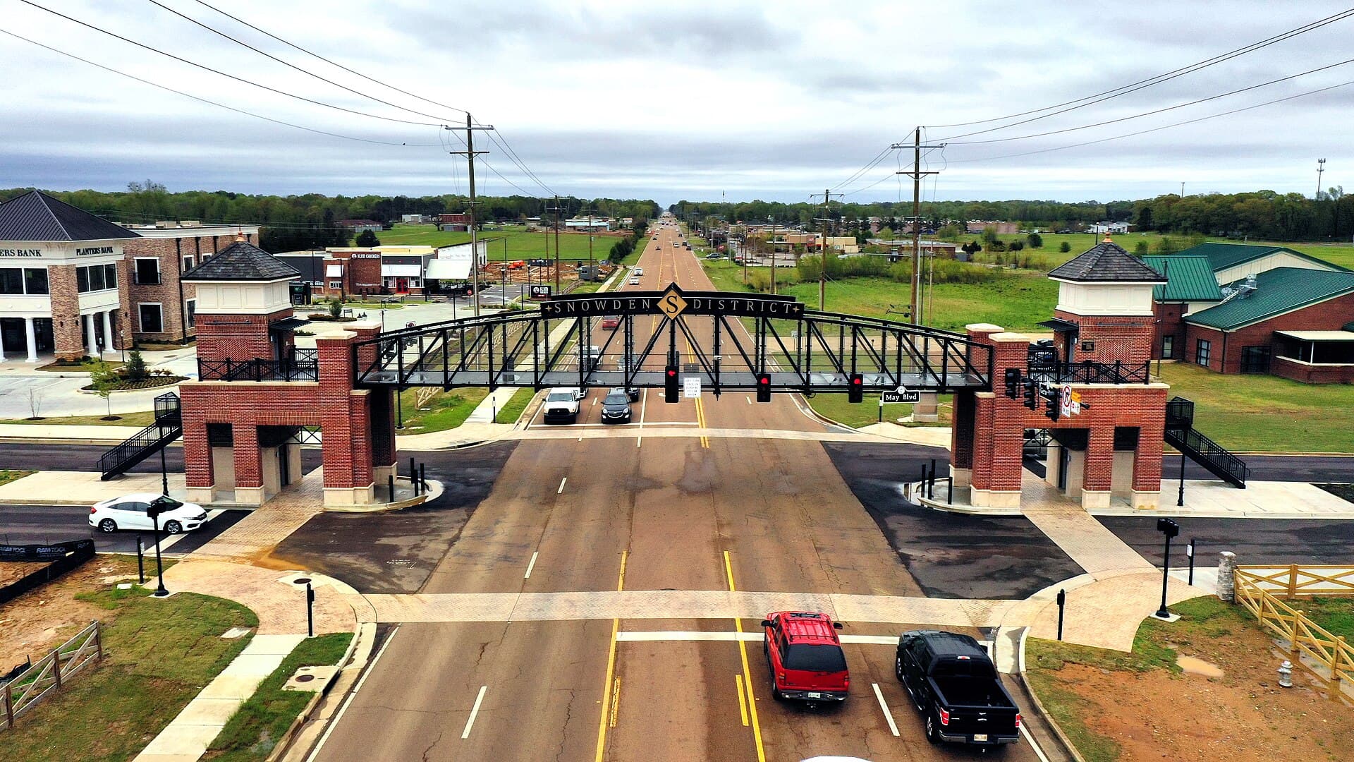The Snowden District pedestrian bridge over Getwell Road at May Boulevard in Southaven, Mississippi, with Silo Square's storefronts at left