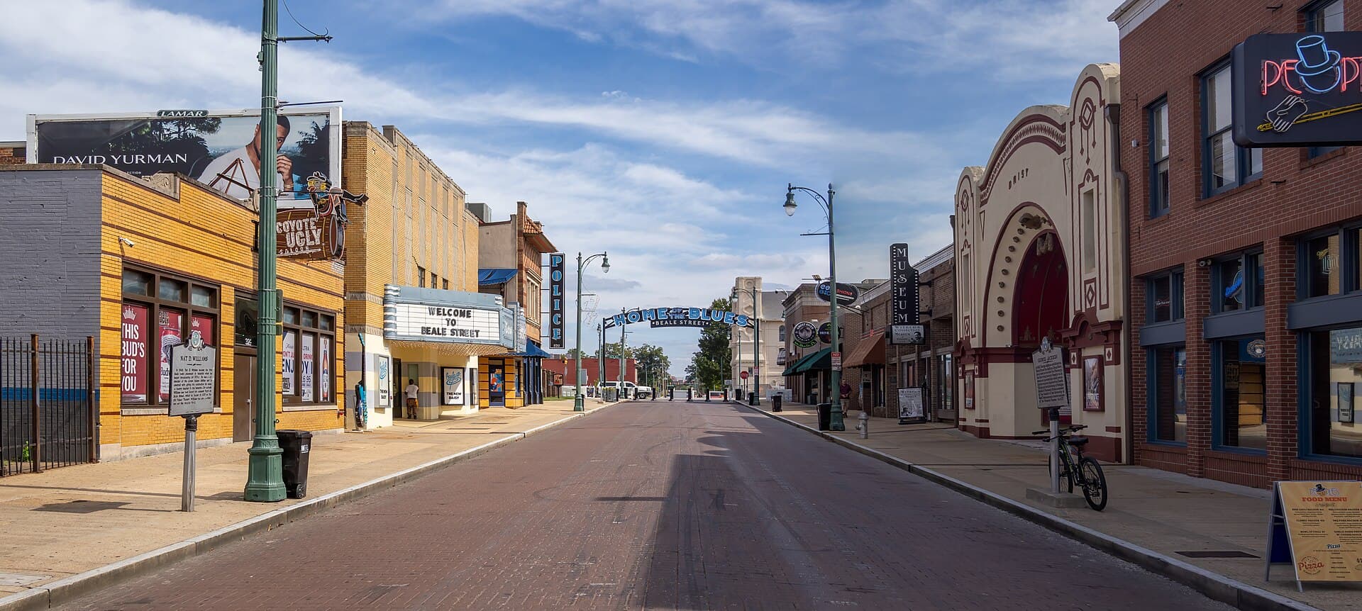 Beale Street in Memphis with the Welcome to Beale Street marquee, the Home of the Blues arch, and the Daisy Theatre