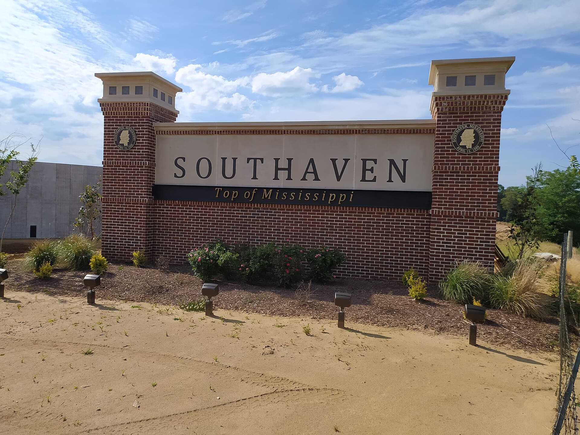 The brick 'Southaven — Top of Mississippi' welcome sign under a blue sky